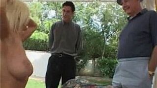 A sexy milf is getting fucked in front of two guys porn video